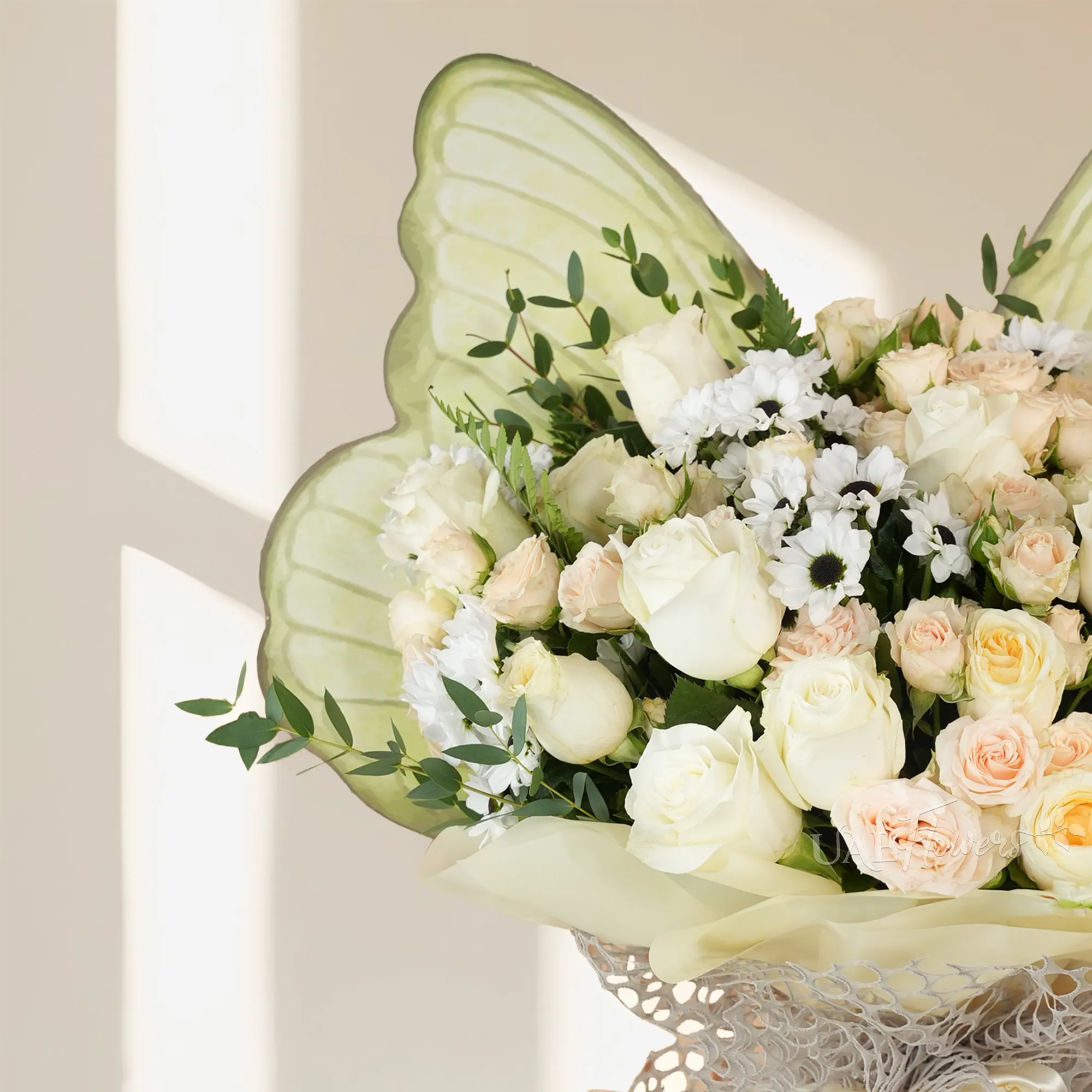 butterfly-shaped bouquet with 8 white roses, 8 pink roses, 4 pink gerberas