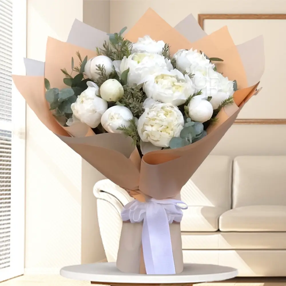 bouquet of 10 white peonies wrapped in brown paper