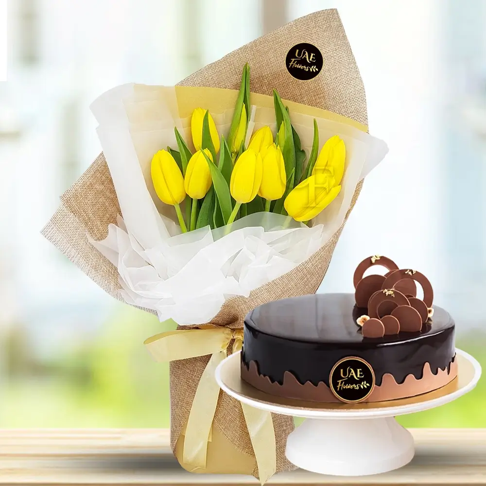 A bouquet of 8 yellow tulips with fillers in brown wrapping paper tied with yellow ribbon and 1 kg of chocolate cake