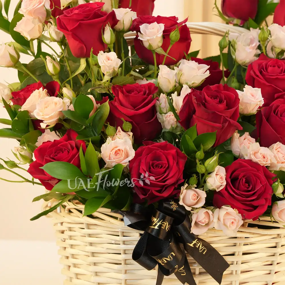20 red roses, 6 pink spray roses, and green fillers