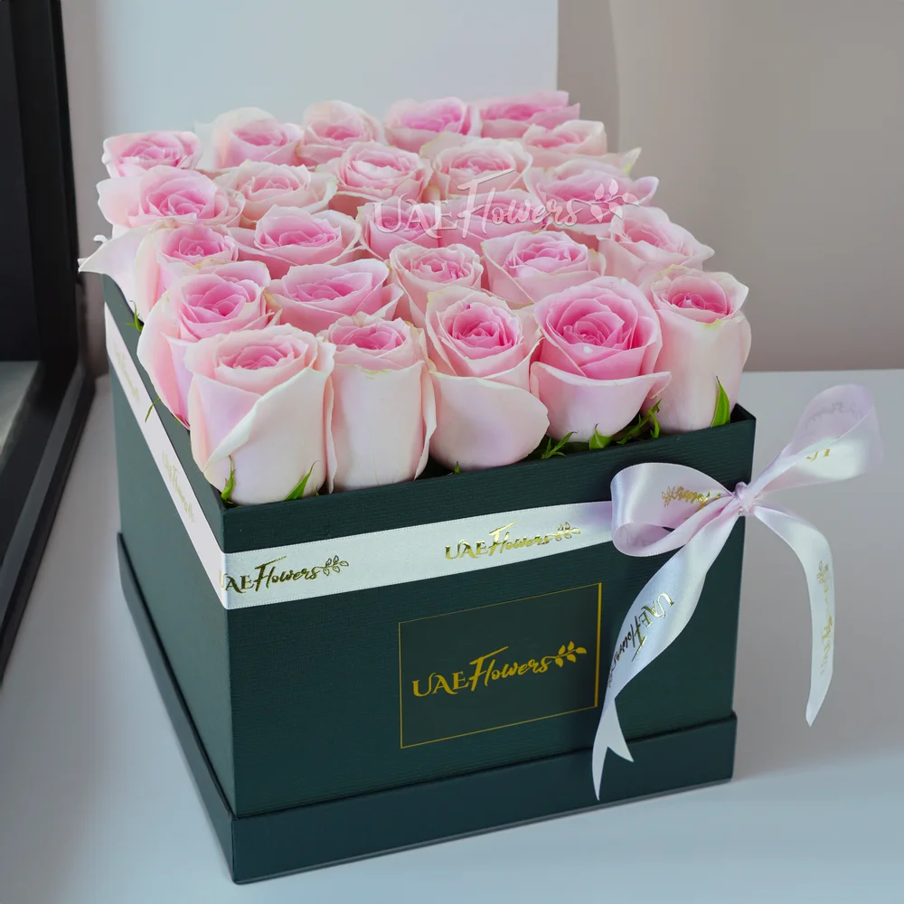 25 pink roses arranged in a square box