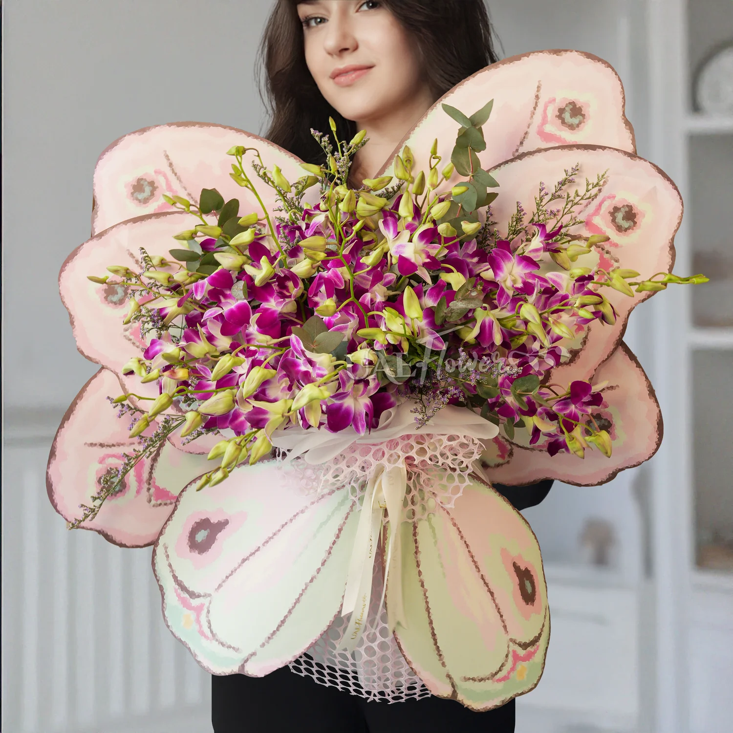 20 purple orchids in a butterfly-shaped bouquet with green fillers