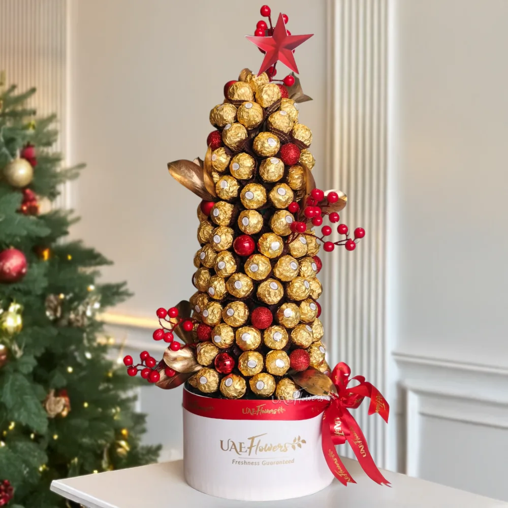 An arrangement of 120 ferrero rocher chocolates in the shape of a christmas tree
