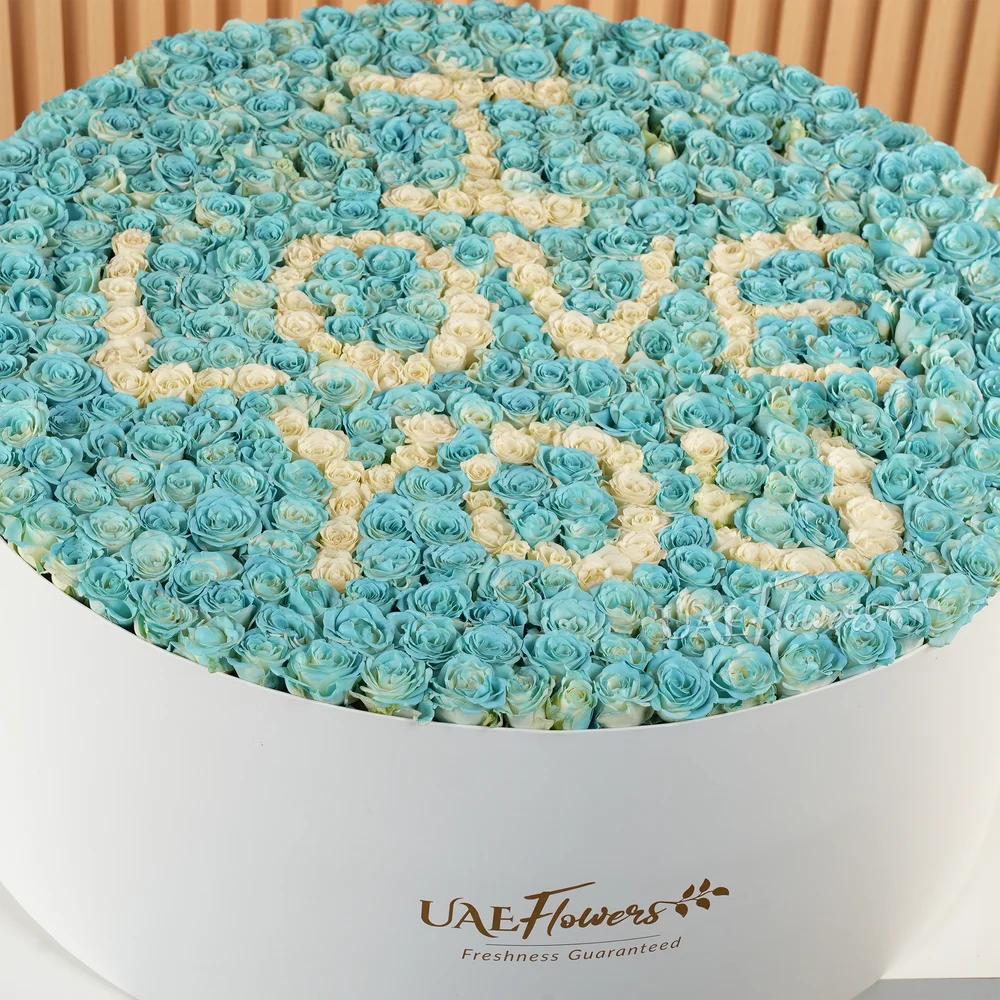 box arrangement of 150 blue and white roses