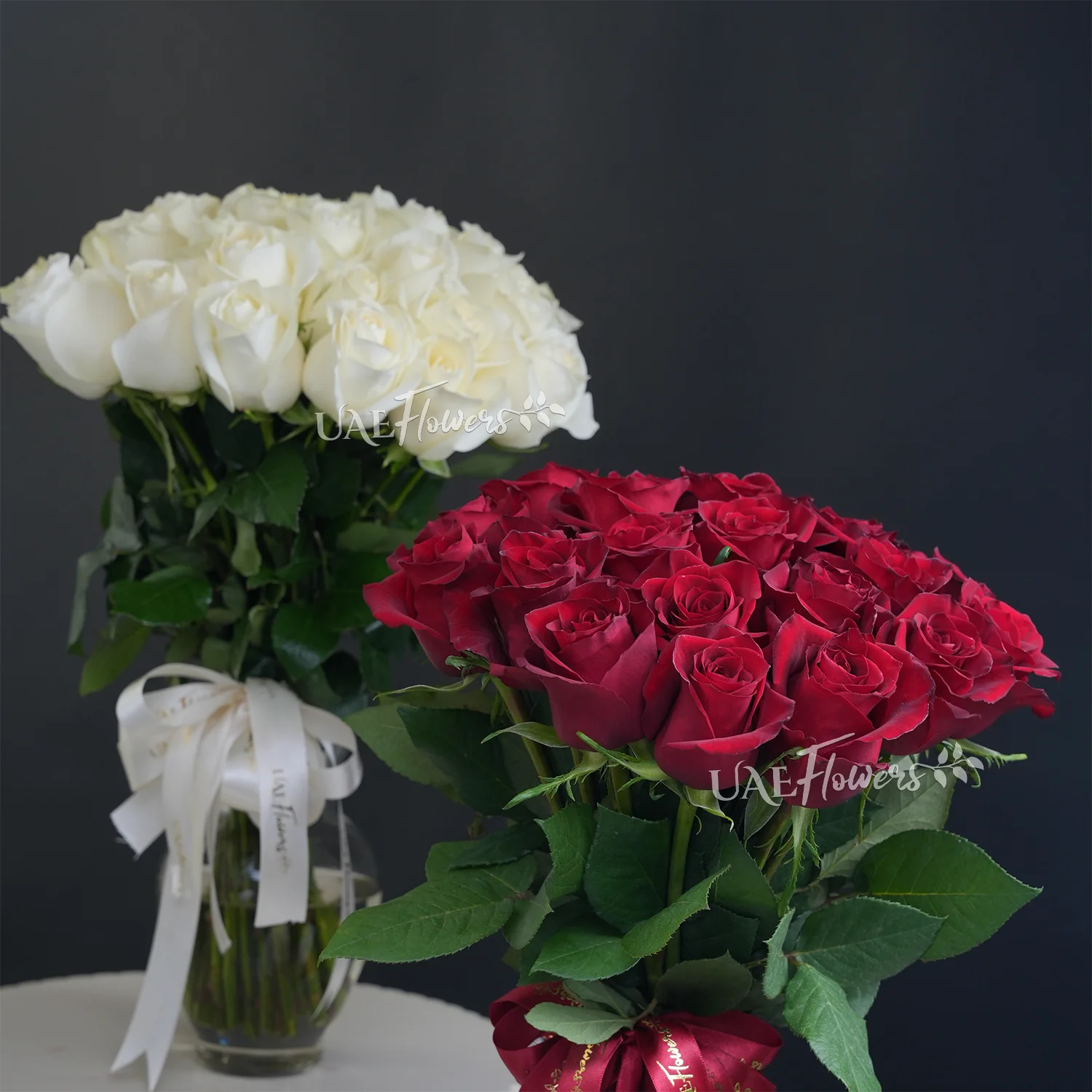 twin vases of 40 red & 40 white roses with fillers