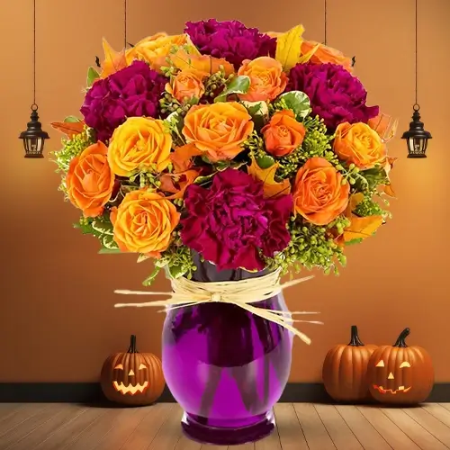 14 orange roses, 6 dark pink carnation, & green fillers in a vase 14 orange roses, 6 dark pink carnation, & green fillers in a vase