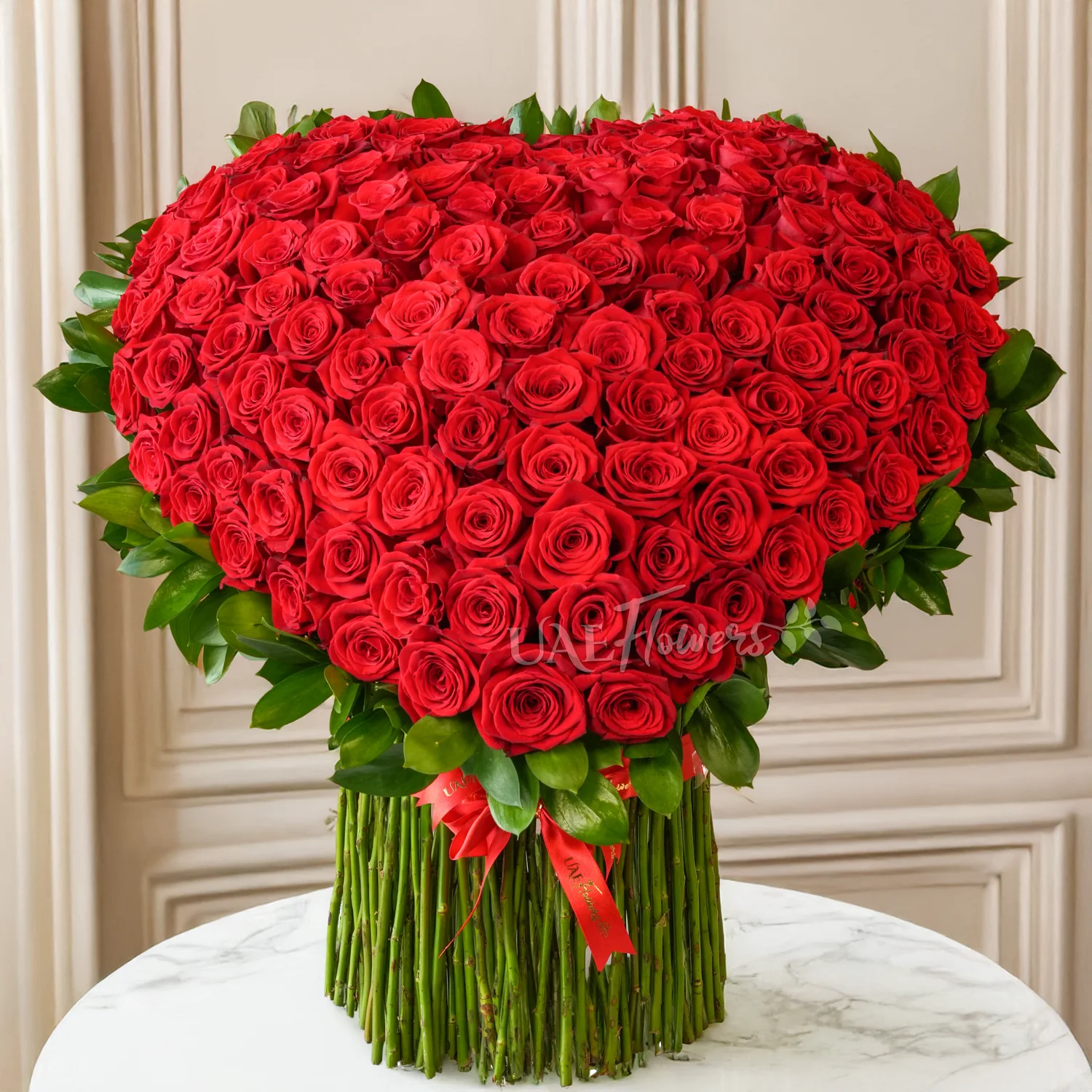 heart-shaped standing arrangement with 120 red roses