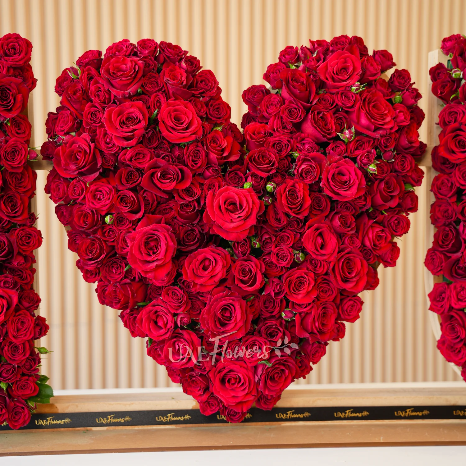 350 to 400 red spray rose buds arranged in an I Love You shape