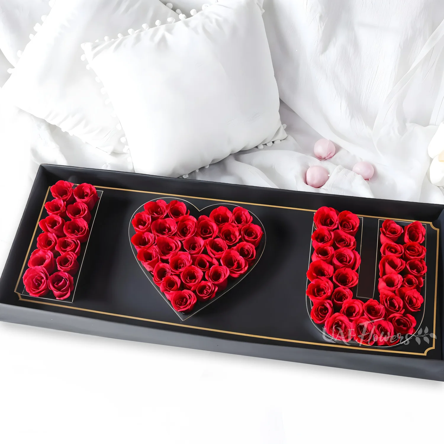30 red roses crafted into an I Love You Shape in a black box