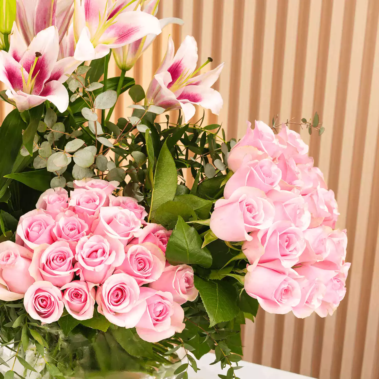 45 pink roses and 3 pink lilies
