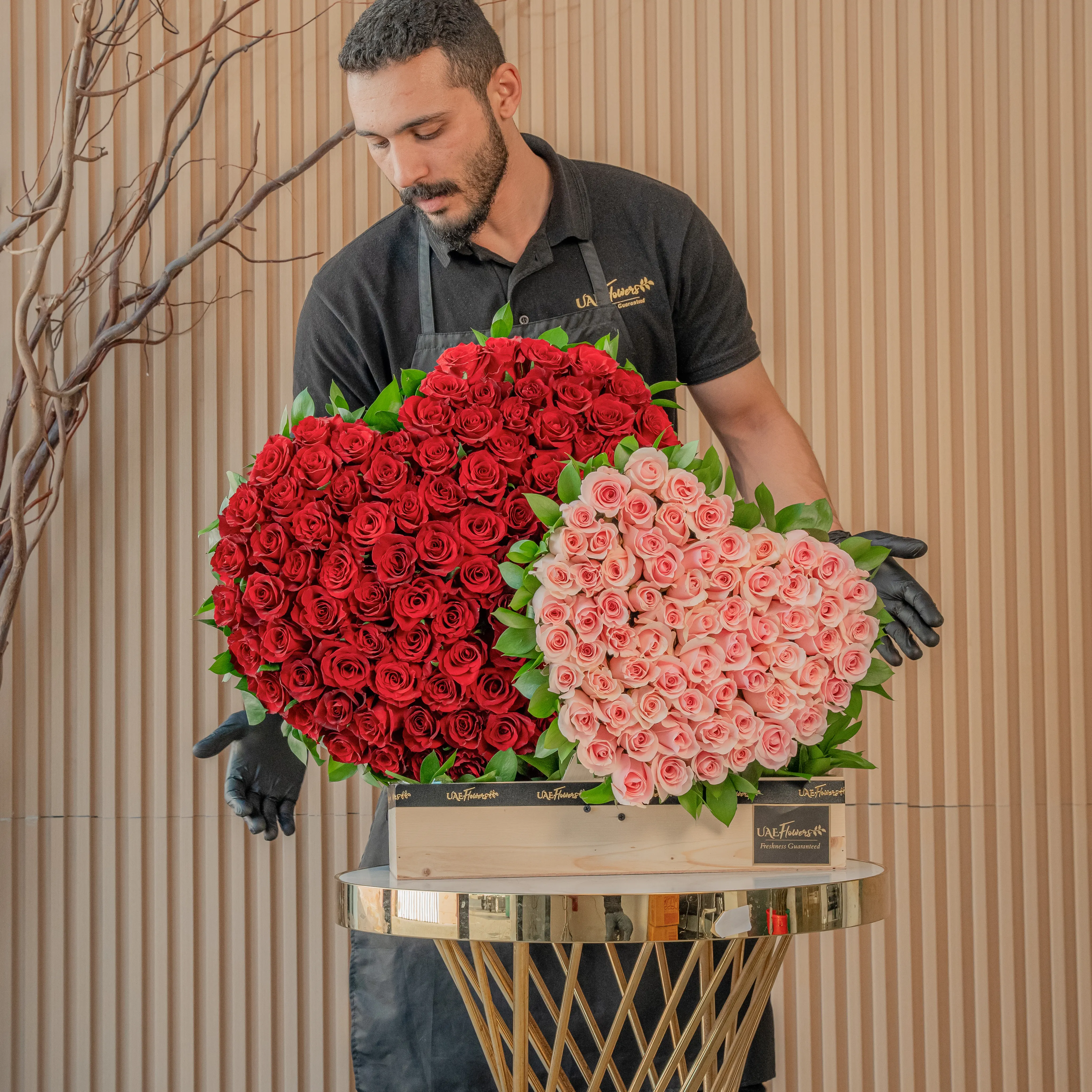 duo heart arrangement has 100 red roses and 50 pink roses