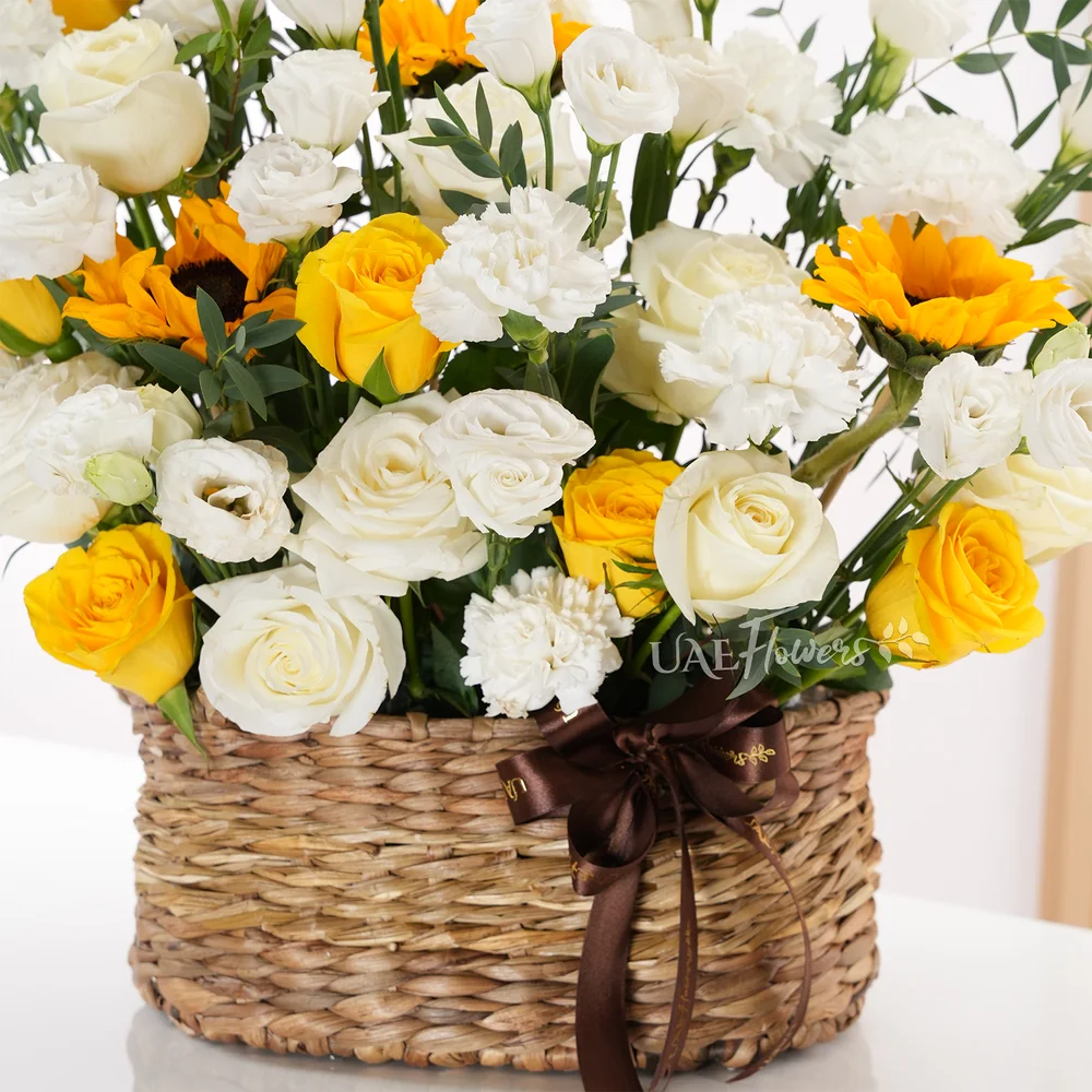 6 white roses, 6 yellow roses, 10 white lisianthus, 2 sunflowers