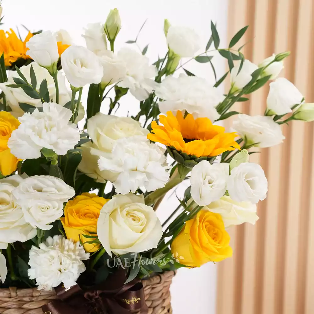 6 white roses, 6 yellow roses, 10 white lisianthus, 2 sunflowers
