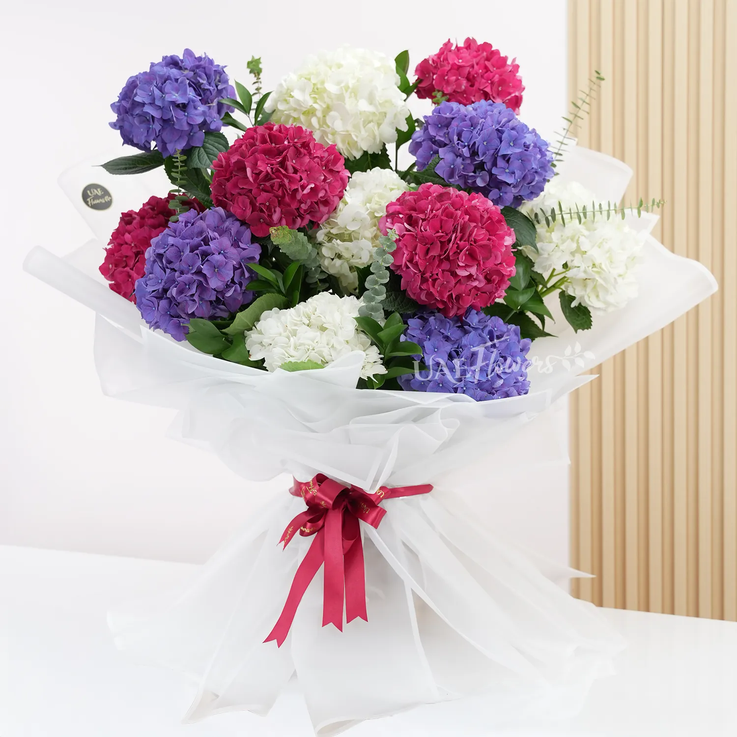 bouquet with red, white, and purple hydrangeas