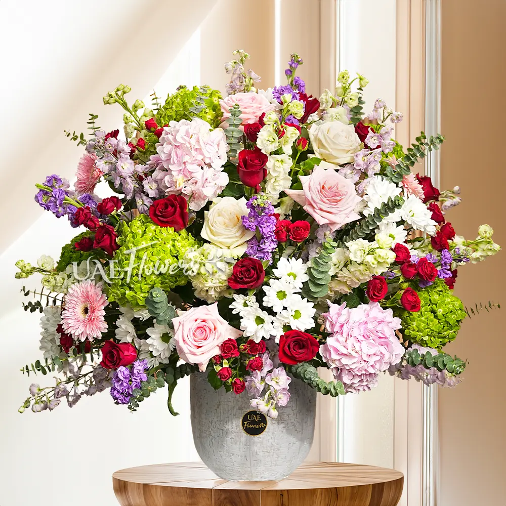 floer arrangement of gerberas and roses in ceramic vase