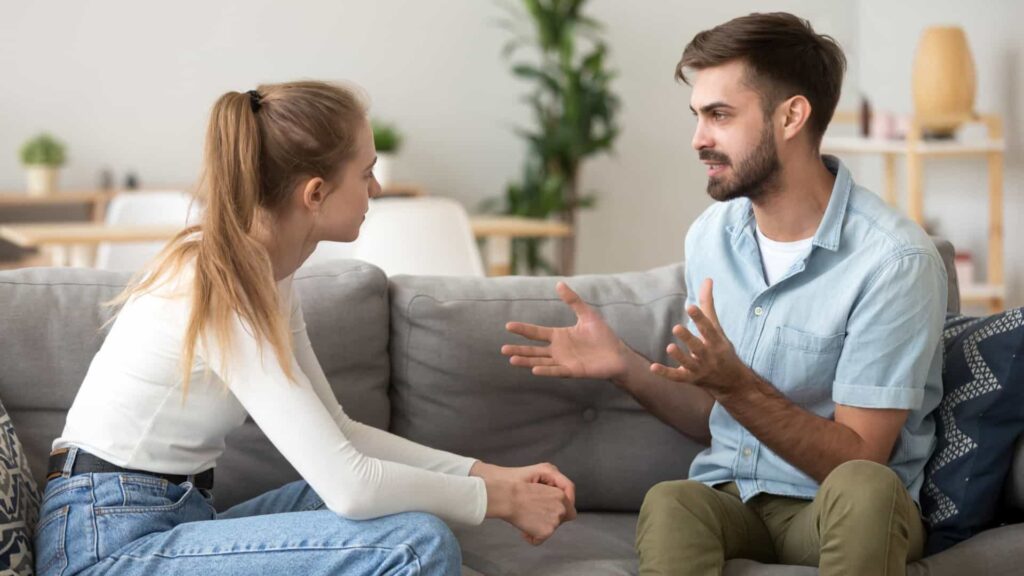 Boy Giving an explanations to his girlfriend