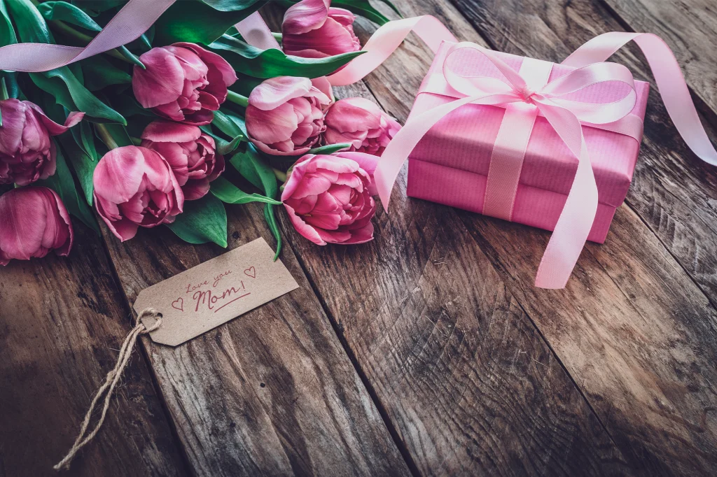 Pink Tulips Bunch With Pink Gift Box in a Wooden Table